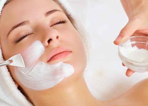 Applying a peel to a woman's face